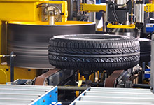 Tire being checked on quality uniformity by machine